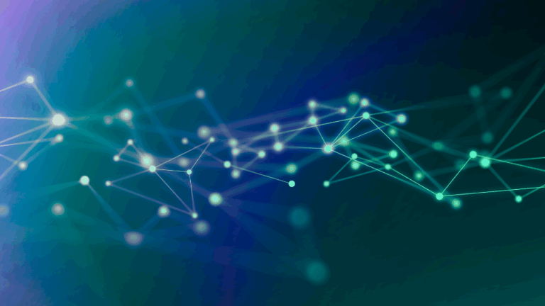 The picture of glowing blue and green connections on a dark background.